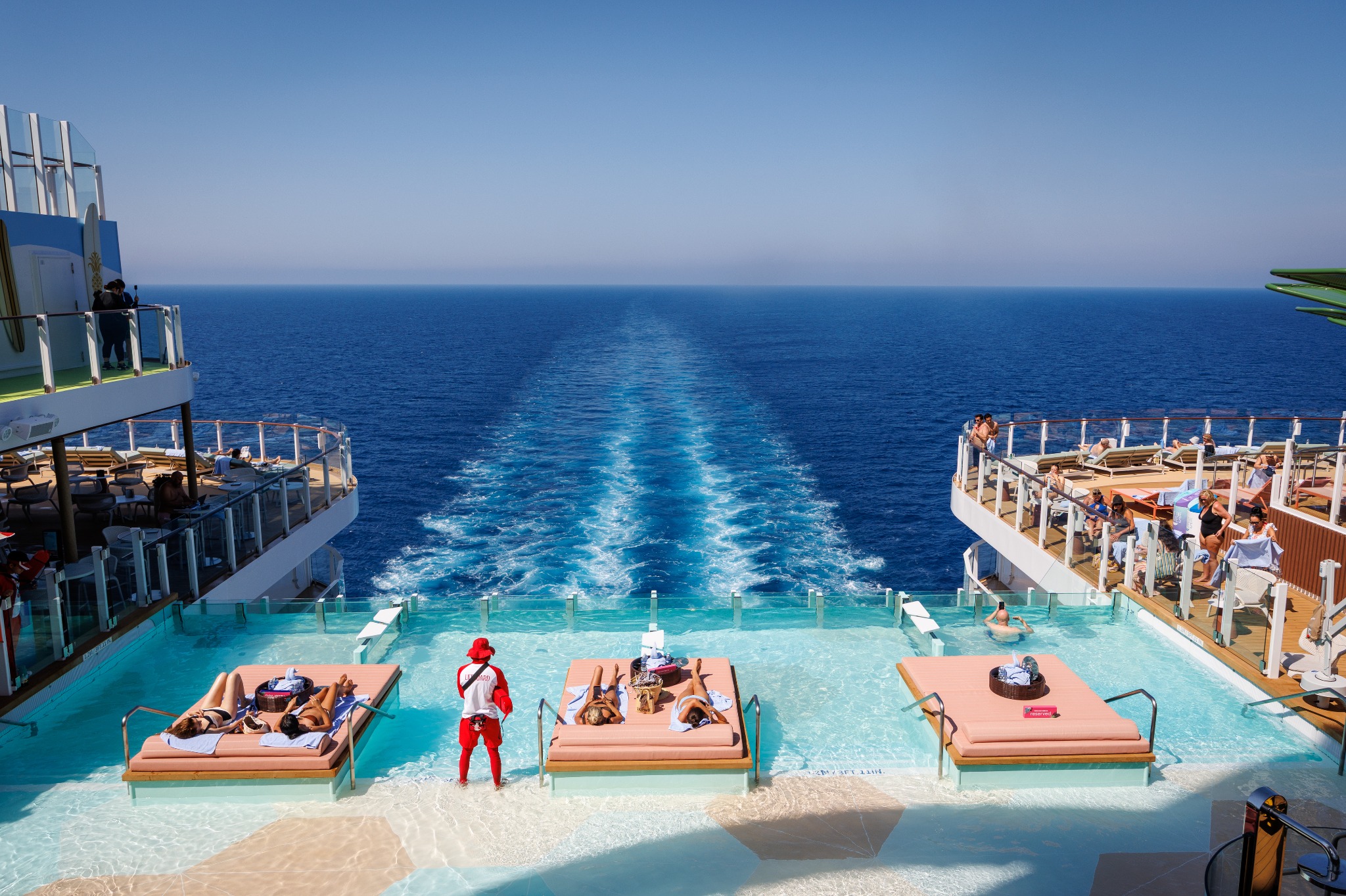 Pool deck and ocean wake aboard a Royal Caribbean cruise ship